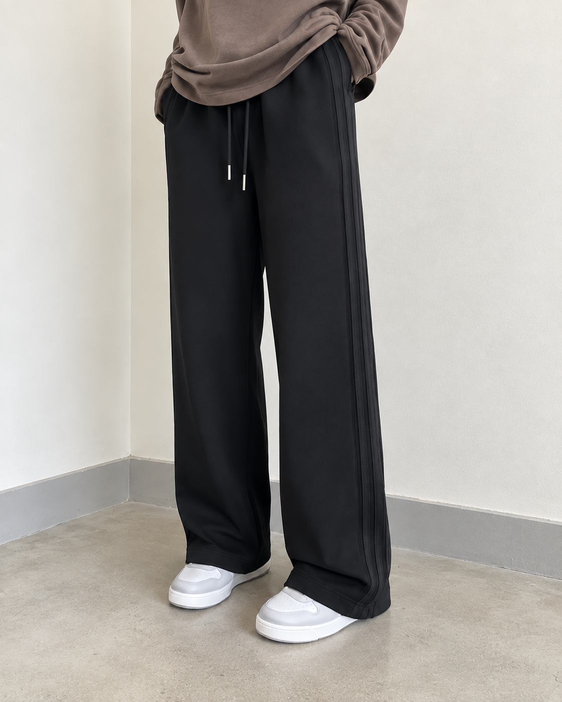 Black high-waisted side-seam wide-leg trousers — back