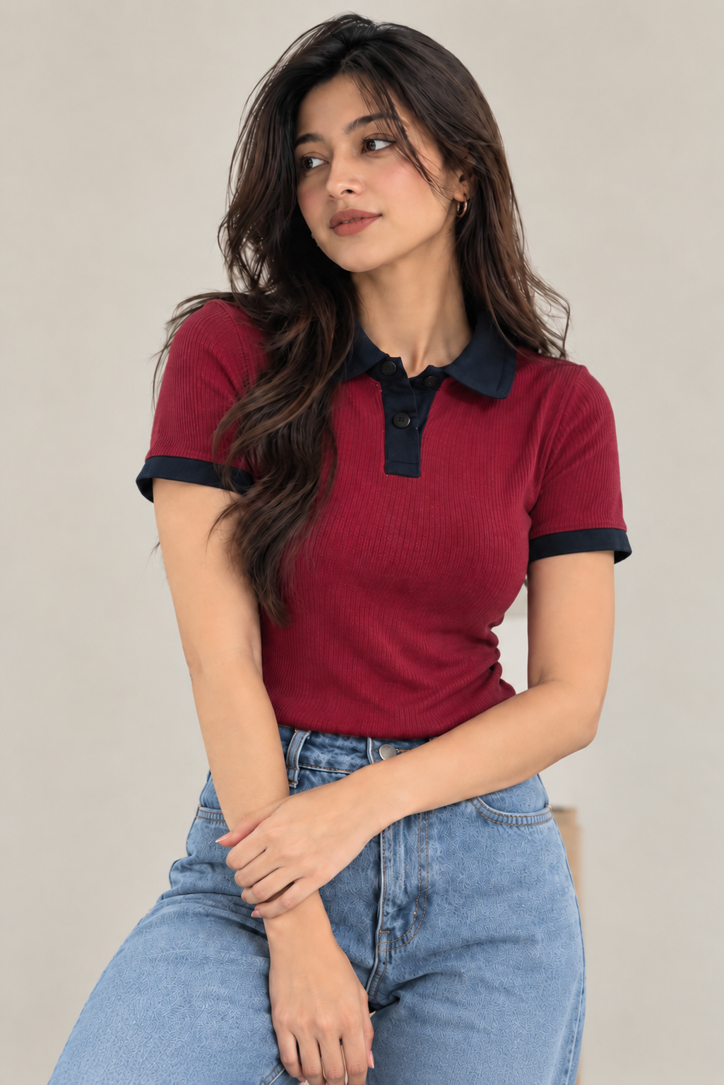 Maroon short-sleeve polo top with black buttons, front pose